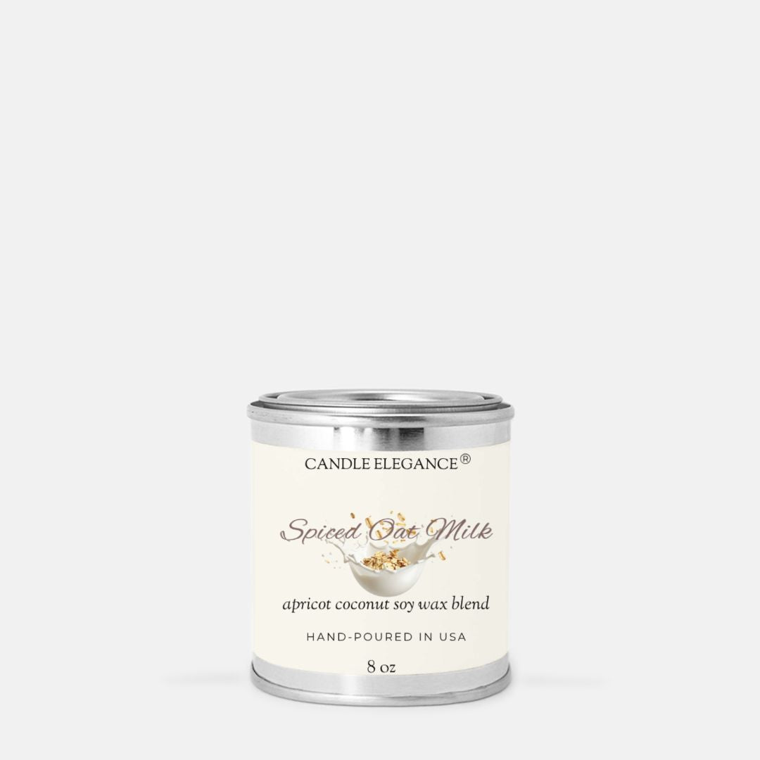 A small cylindrical metal candle tin with a cream label reading 'Candle Elegance Sage & Cypress' on a light gray background.