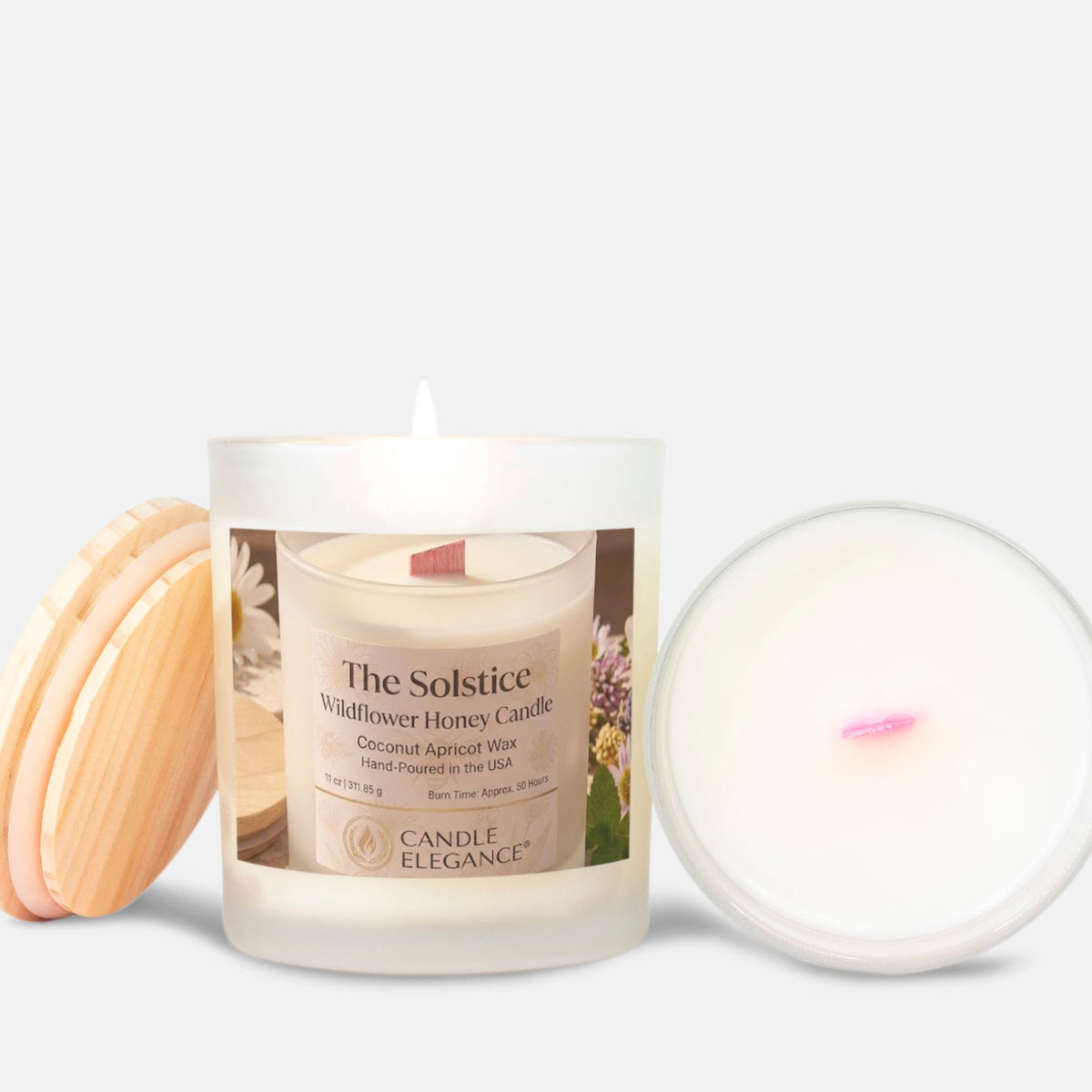 A Candle Elegance 'The Solstice' wildflower honey candle in a frosted glass jar, shown with its light wood lid on the left and the pink wooden wick on the right against a light gray background.