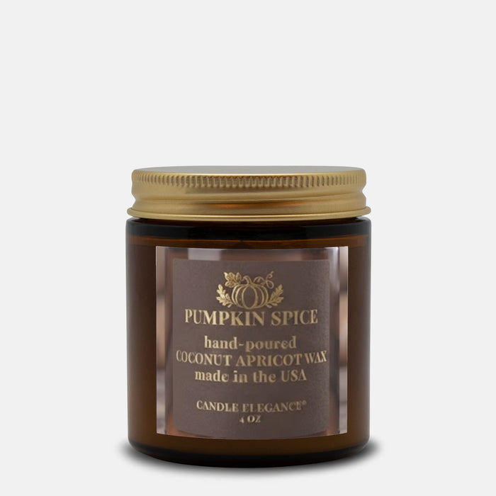 A 4 oz amber glass jar candle with a gold metal lid and a brown label reading 'Pumpkin Spice' by Candle Et Egance, set against a light gray background.