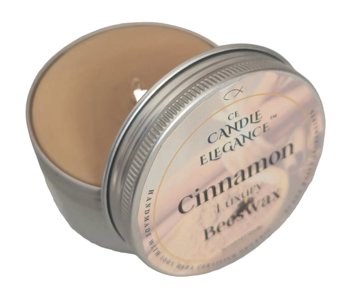 4 oz organic beeswax travel candle in a tin, scented with a warm cinnamon essential oil blend.