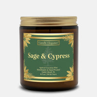 A Candle Elegance 'Sage & Cypress' scented candle in an amber glass jar with a gold metal lid and a green label with gold accents, set against a light gray background.