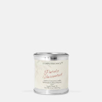 A silver metal candle tin with a cream-colored label reading 'Candle Elegance Purely Unscented' on a light gray background.