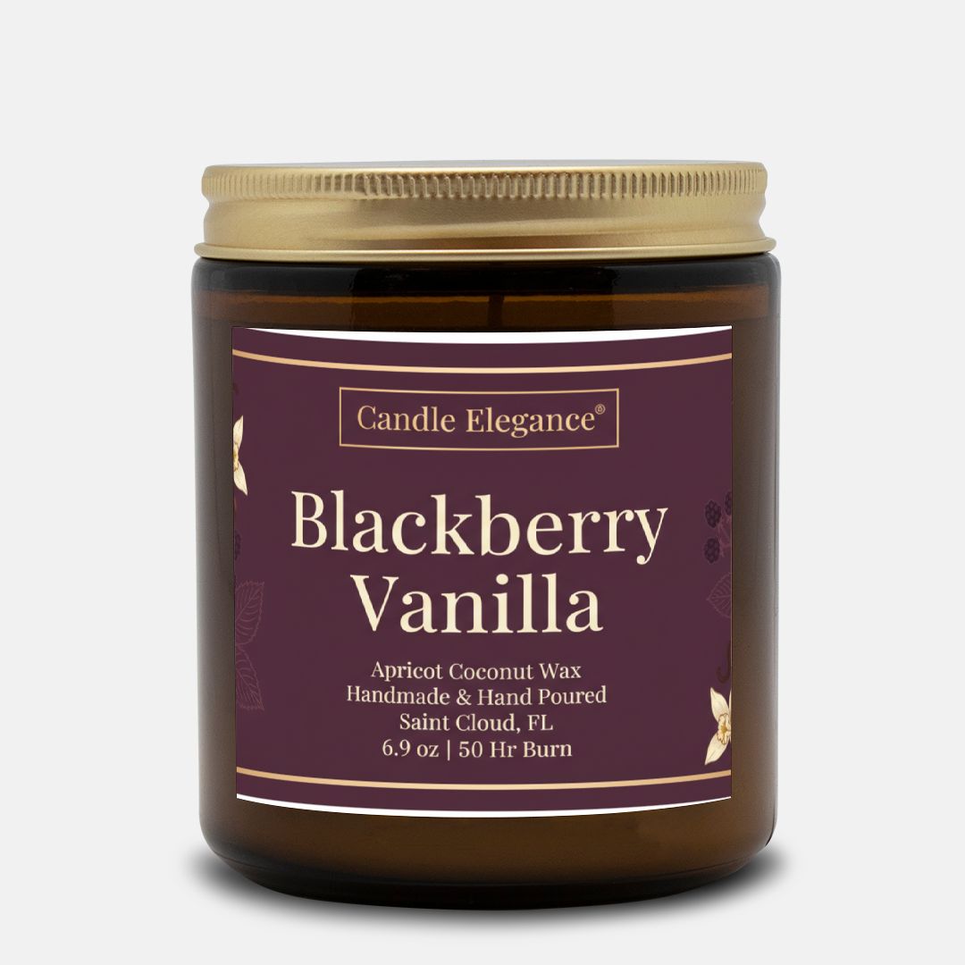 A jar of Candle Elegance Blackberry Vanilla scented wax candle, featuring a dark purple label with gold text and a gold metal lid, set against a light gray background.