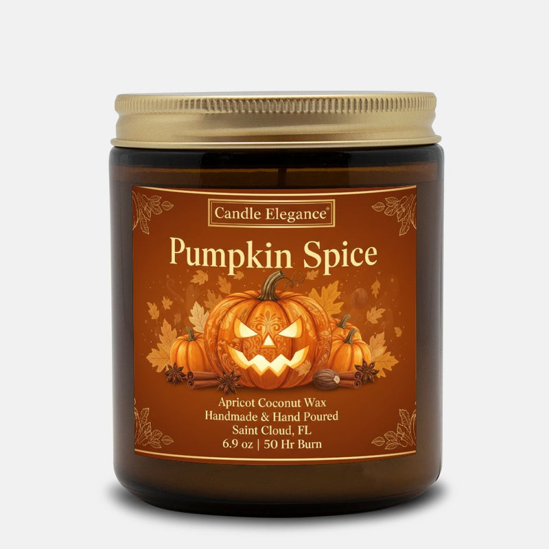 A Candle Elegance Pumpkin Spice scented candle in a dark amber glass jar with a gold metal lid and a brown label featuring a jack-o'-lantern illustration.