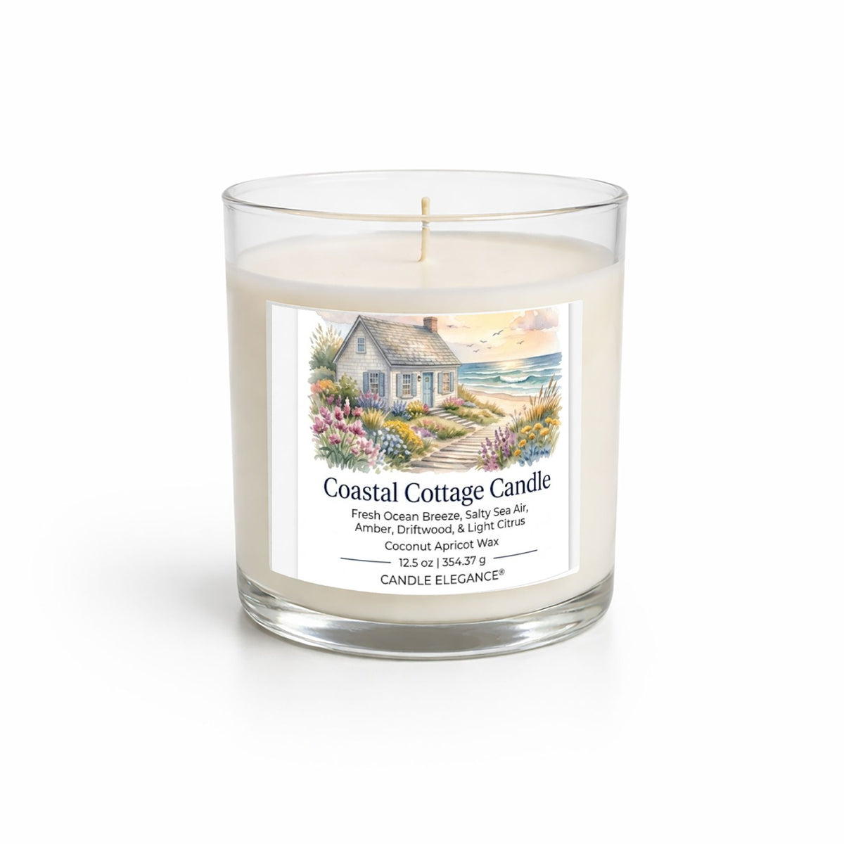 A Coastal Cottage Candle in a clear glass jar with cream-colored wax and a white label featuring an illustration of a cottage by the sea. The brand CANDLE ELEGANCE is visible at the bottom of the label.