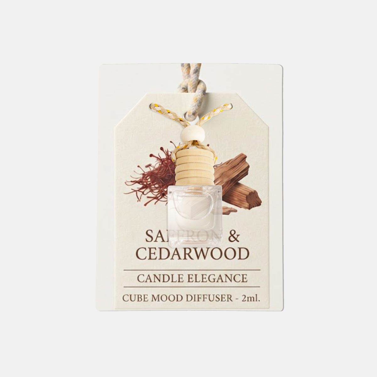A 2ml cube mood diffuser from Candle Elegance, featuring a small clear cube filled with wax and a light wood diffuser core, attached to a cream-colored hanging tag with illustrations of saffron and cedarwood.