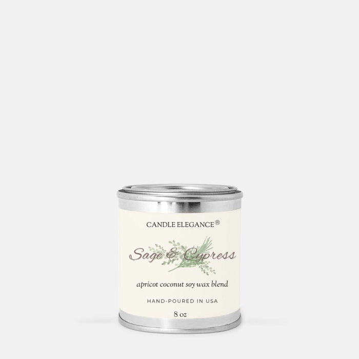 A small cylindrical metal candle tin with a cream label reading 'Candle Elegance Sage & Cypress' on a light gray background.