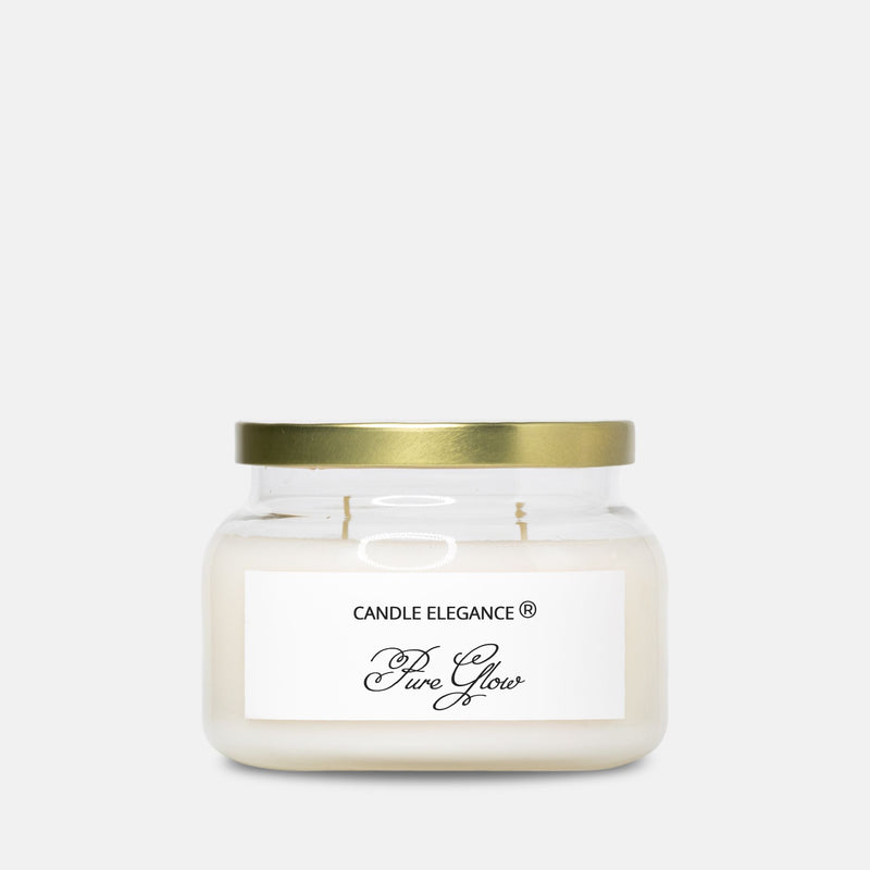 A jar candle with cream-colored wax, a white label reading 'CANDLE ELEGANCE Pure Glow', and a metallic gold lid, set against a plain light gray background.