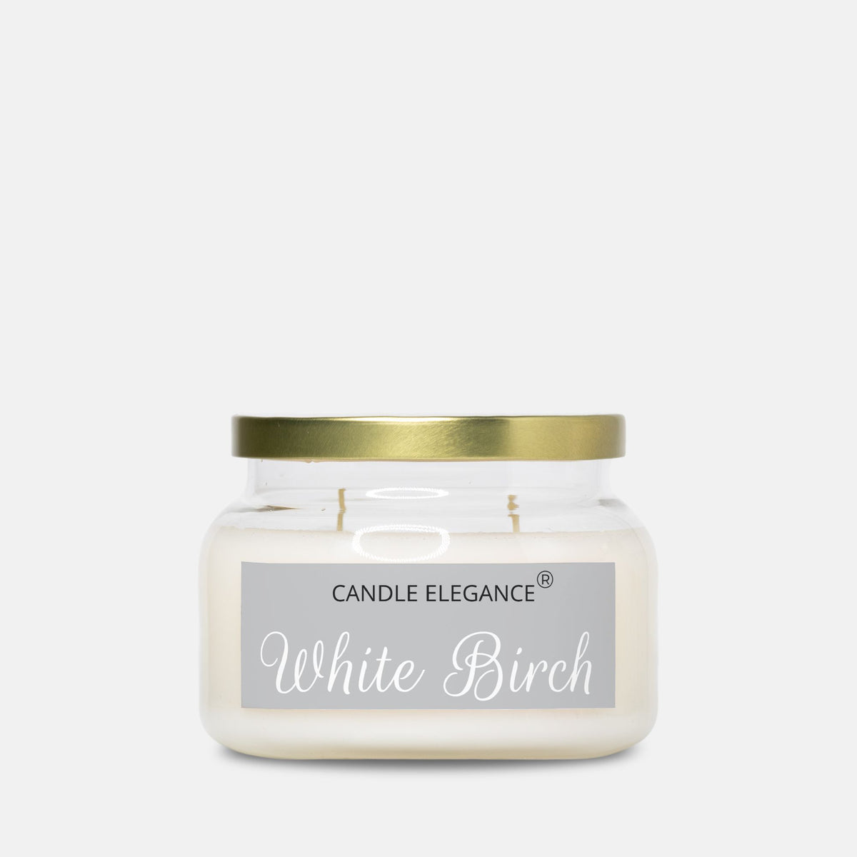 A white soy wax candle in a clear glass jar with a metallic gold lid and a gray label reading 'CANDLE ELEGANCE White Birch'.