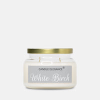 A white soy wax candle in a clear glass jar with a metallic gold lid and a gray label reading 'CANDLE ELEGANCE White Birch'.