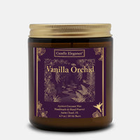 A Candle Elegance Vanilla Orchid scented candle in an amber glass jar with a gold metal lid and a dark purple label featuring gold botanical illustrations.