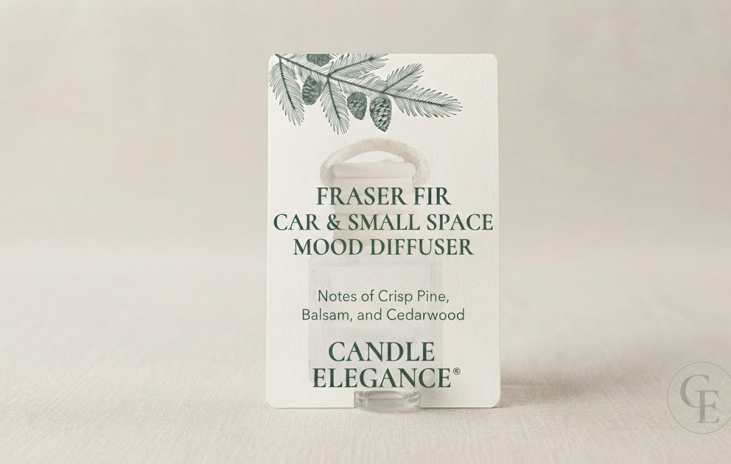 A white rectangular product card for the Candle Elegance Fraser Fir Car & Small Space Mood Diffuser, shown standing upright on a clear stand against a soft light beige background.