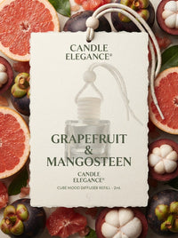 A vertical white product tag for Candle Elegance Grapefruit & Mangosteen cube mood diffuser refill, surrounded by sliced grapefruit, mangosteen fruits, and green leaves on a white background.