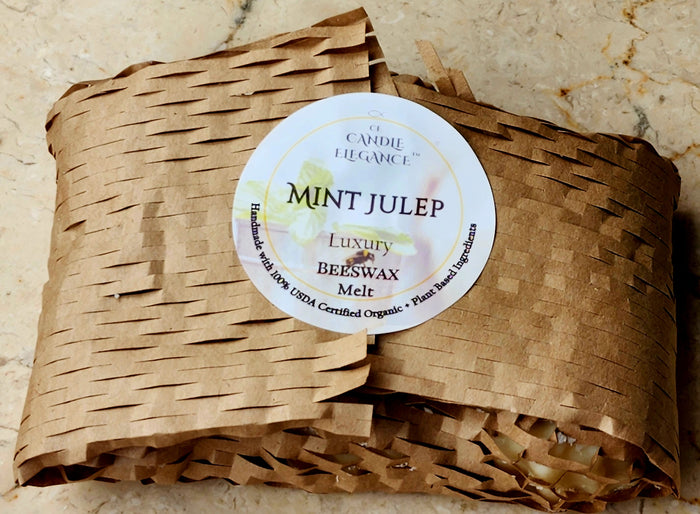 Beeswax melt in brown paper packaging with a label on a beige background