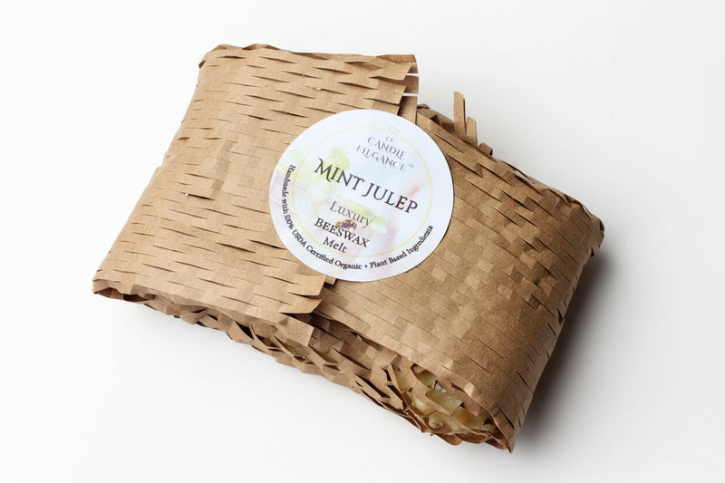 Beeswax melt in brown paper packaging with a label on a beige background