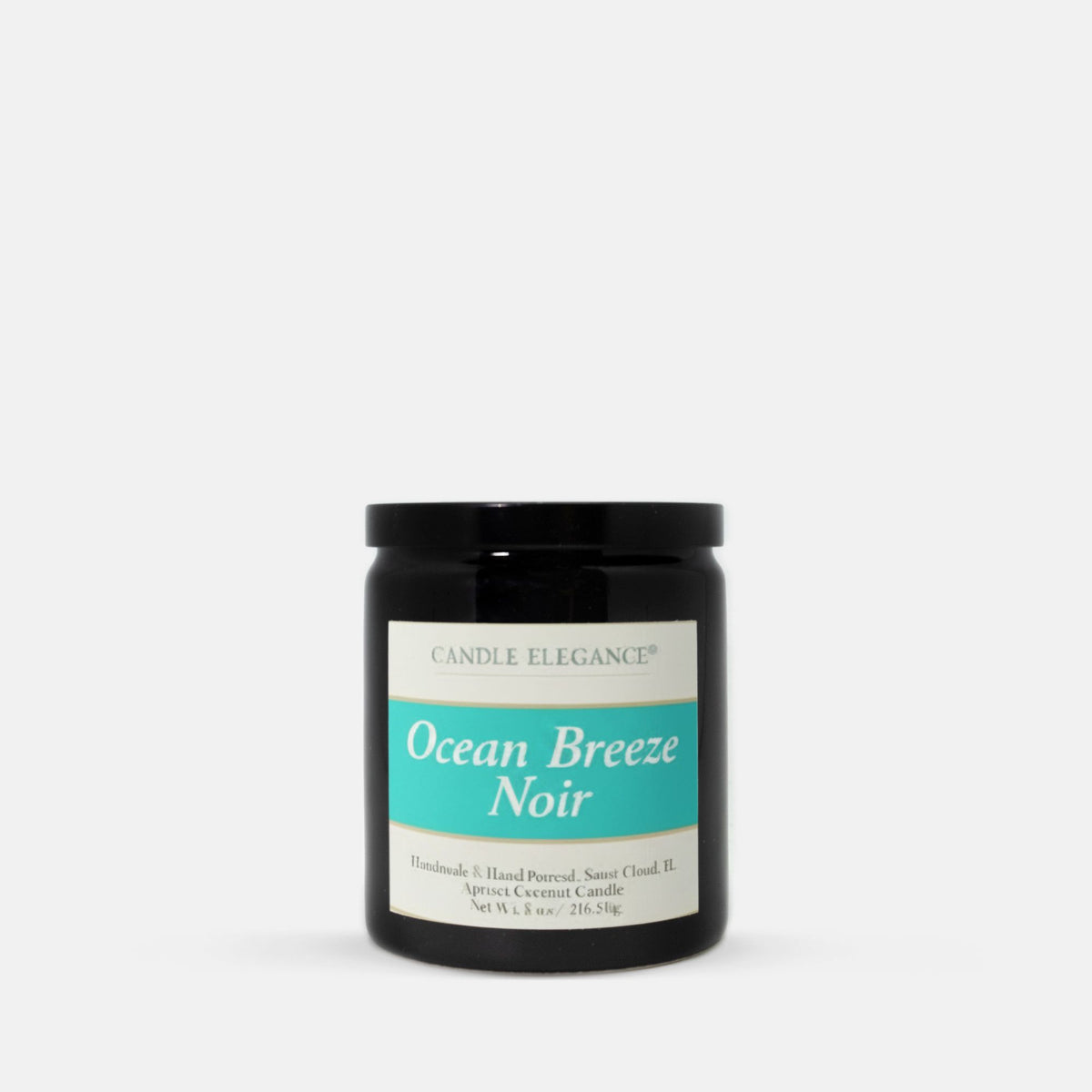 A black glass jar candle with a black lid and a white label featuring a turquoise band that reads 'Ocean Breeze Noir' by Candle Elegance, centered on a light gray background.
