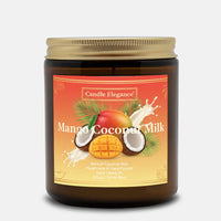 A Candle Elegance Mango Coconut Milk scented candle in a dark amber glass jar with a gold metal lid, set against a light gray background.