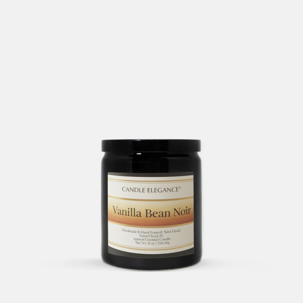A black glass jar candle with a black lid and a cream label reading 'Candle Elegance' and 'Vanilla Bean Noir' on a light gray background.