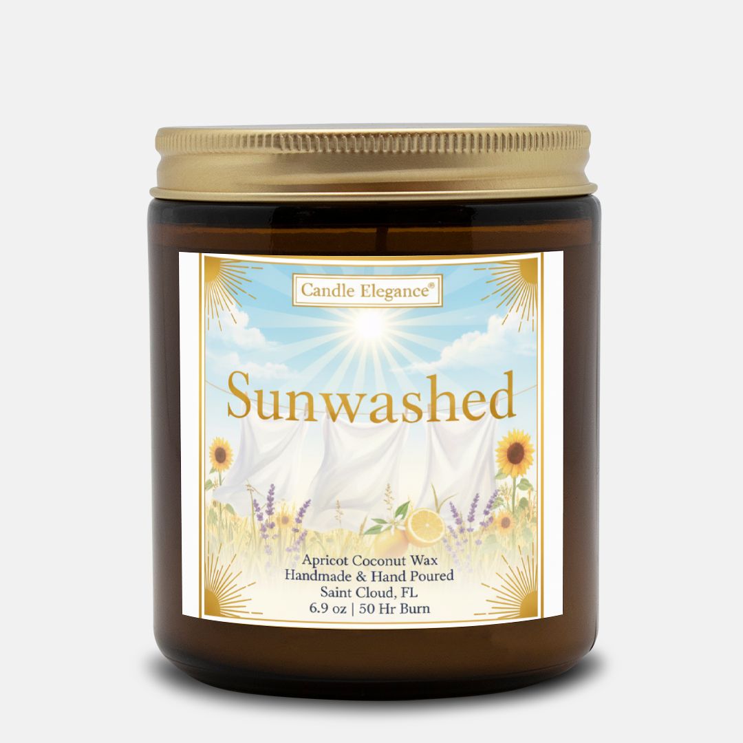 A 6.9 oz amber glass jar candle with a gold lid and a decorative label reading 'Sunwashed' by Candle Elegance, set against a light gray background.