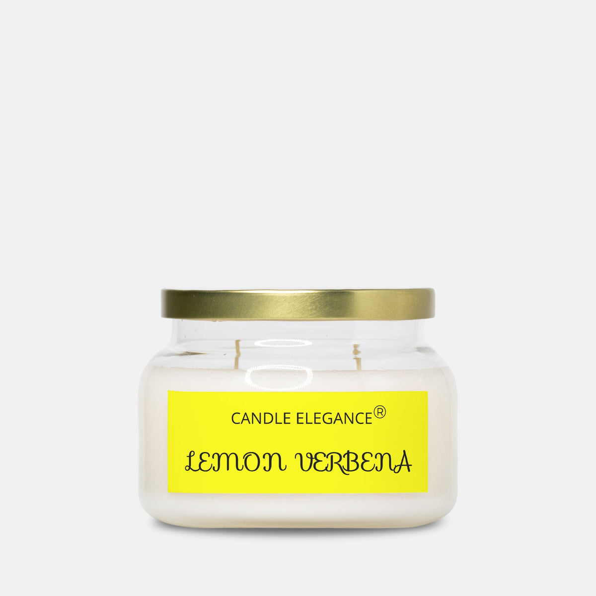 A Candle Elegance 'Lemon Verbena' scented candle in a clear glass jar with a gold metal lid and a bright yellow label, set against a plain light gray background.