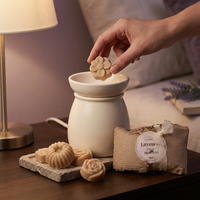 Lavender flower wax melt being placed into an electric warmer