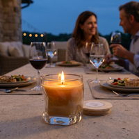 Lit beeswax candle at an intimate dinner