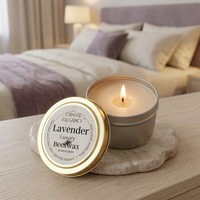 Lit Lavender travel candle with creamy beige beeswax and a single cotton wick
