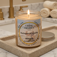 Lit Madagascar Vanilla candle on a luxe marble bath counter