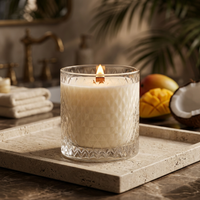 Lit Mango & Coconut Milk candle in a luxe tropical spa