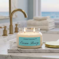 Lit Ocean Breeze candle on a luxe bath counter