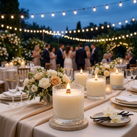 Outdoor wedding reception with lit Cashmere Vanilla candles and vanilla accents