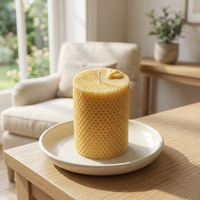 Unlit Bee Pillar candle in a sunlit cottage living room