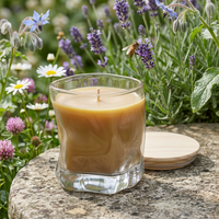 Unlit beeswax candle in a pollinator garden