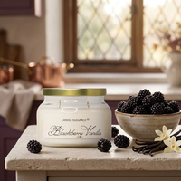 Unlit Blackberry Vanilla candle with blackberries and vanilla in a sunlit kitchen