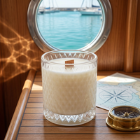 Unlit Coastal Cottage candle in a sailboat cabin at the marina