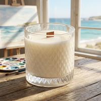 Unlit Coastal Cottage candle in a seaside artist’s studio