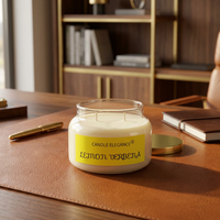 Unlit Lemon Verbena candle on a cognac leather desk