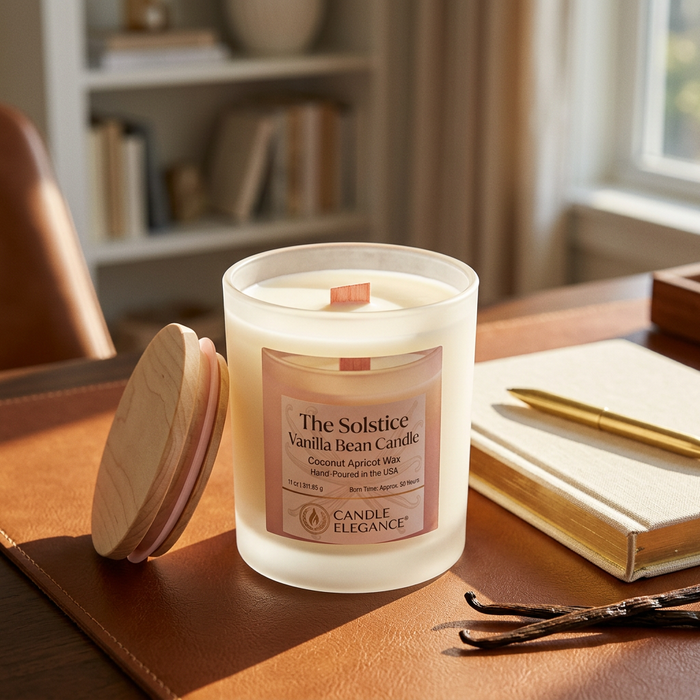 Unlit Solstice Vanilla Bean candle on a cognac leather desk